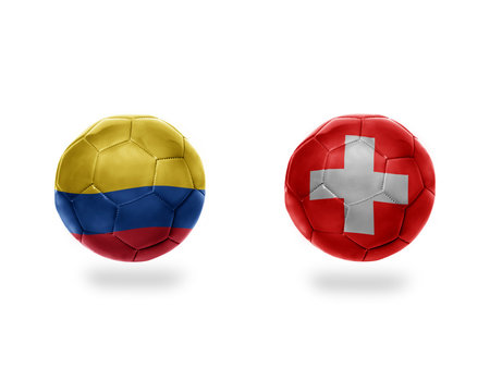 football balls with national flags of colombia and switzerland. 3D illustration