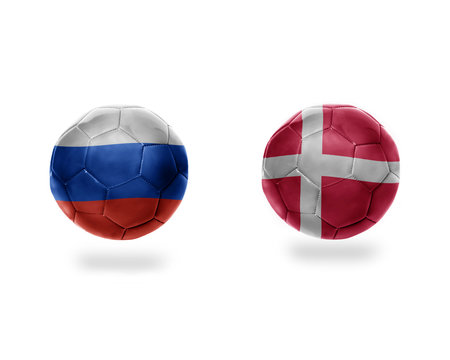 football balls with national flags of denmark and russia.