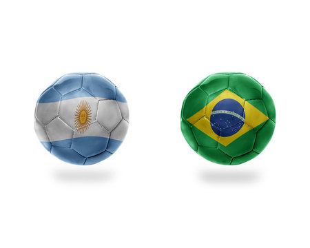 football balls with national flags of argentina and brazil.