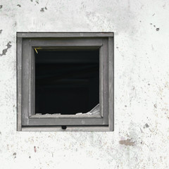 Old aged rusted grey black white shack hut wall paint broken window glass wooden frame rusty dirty gray painted large horizontal copy space grunge rust dirt crime poverty broken windows theory concept