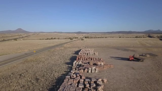 Aerial of pallets of flagstone in a storage lot