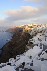 Famous stunning view of white architectures and colors above the volcanic caldera in the village of Oia in Santorini island, Greece