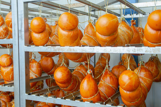 Sausage. Sausage production line. Sausage on the counter for the smokehouse. Industrial manufacture of sausages. Meat shop