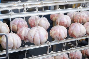 Chicken. The line for the production of smoked delicacies. Industrial manufacture of sausage...