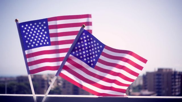 USA national hand flag waving . Great for any patriotic and american national holiday like 4ht of July, Flag day, national day or memorial day. Slow motion from 120 fps original clip