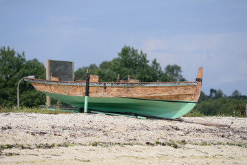 wooden fishing boat dries ashore