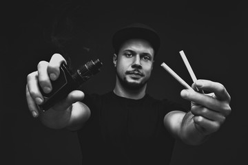 Vaping man and cigarettes your choice