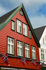 Red house with norwegian flags in Bergen