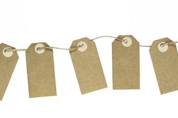 Blank brown note cards with copy space stuffed on brown rope like garland and isolated on white background