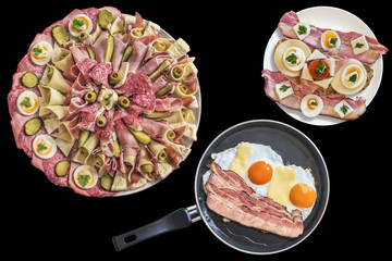 Appetizer Savory Dish Served with Fried Eggs Bacon and Cheese in Frying Pan with Gourmet Sandwich and Extra Bacon Rashers Isolated on Black Background