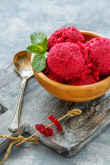 Wooden bowl with homemade beetroot ice cream.