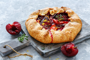 Homemade pies (Galette) with yellow and red plums.