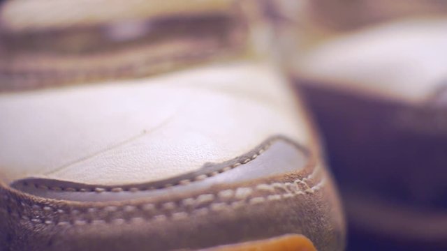 old worn leather sport training sneakers close-up