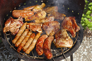 Smoking meat on barbecue grill