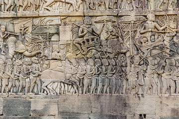 Fototapeta na wymiar Bayon temple wall carvings at Angkor Thom in Cambodia