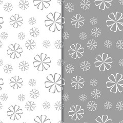 White and gray floral backgrounds. Set of seamless patterns