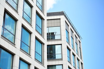 Urban abstract background, detail of modern glass facade, office business building.