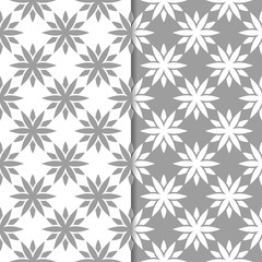 White and gray floral backgrounds. Set of seamless patterns