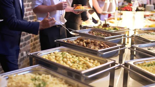 people group catering buffet food indoor in luxury restaurant with meat colorful fruits and vegetables.