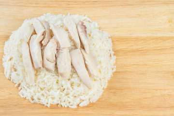 Steamed chicken and rice on wood background