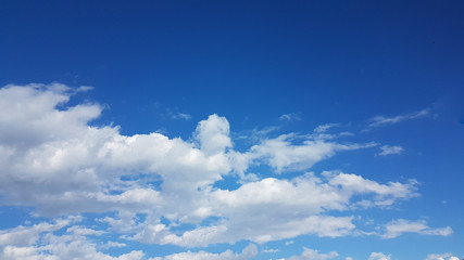 Naklejka na ściany i meble sky blue clouds white like cotton spring time