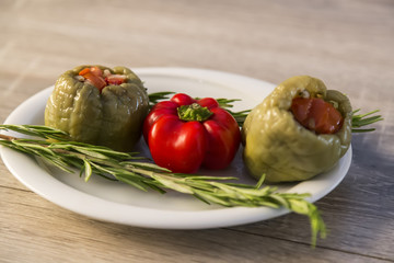 olive oil stuffed and lemon in the plate on the wooden table for restaurant. 