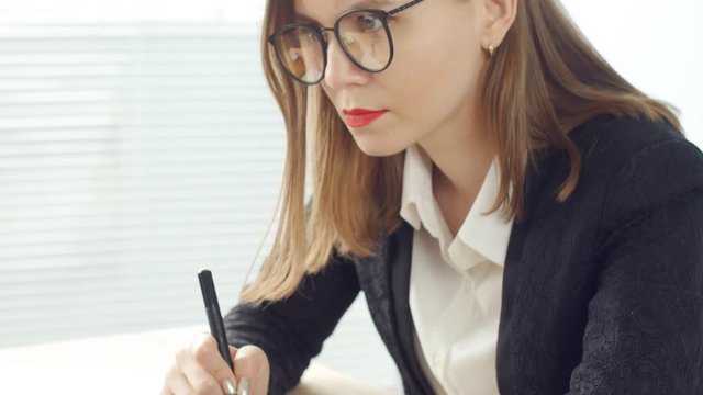 Woman designer working in office with graphic tablet