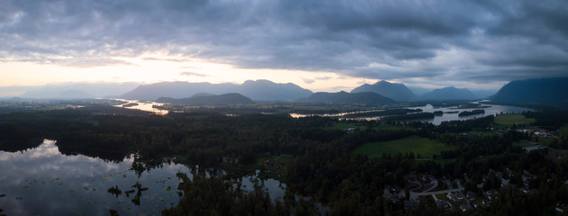 Aerial view of the beautiful Canadian Landscape during a striking sunset. Taken near Chilliwack, East of Vancouver, British Columbia, Canada.