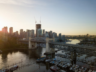 Aerial view of Burrard Bridge in False Creek During a vibrant sunrise. Taken in Downtown Vancouver, BC, Canada.