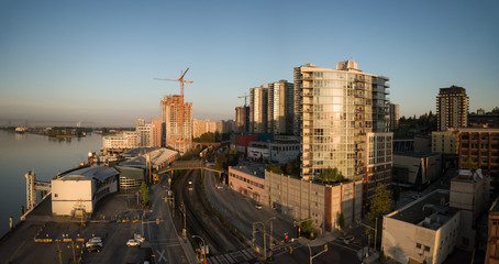 Aerial view of Downtown city during a vibrant sunrise. Taken in New Westminster, Greater Vancouver, British Columbia, Canada.