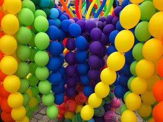 Colorful balloons background. Rainbow color balloons put together.