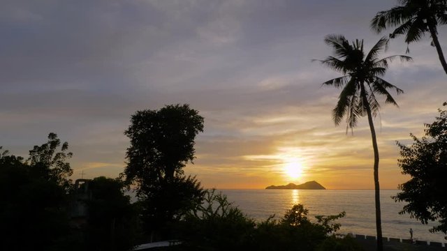 Sundown over the island of Mararison or Malalison in the Philippines