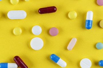 different pills are scattered
