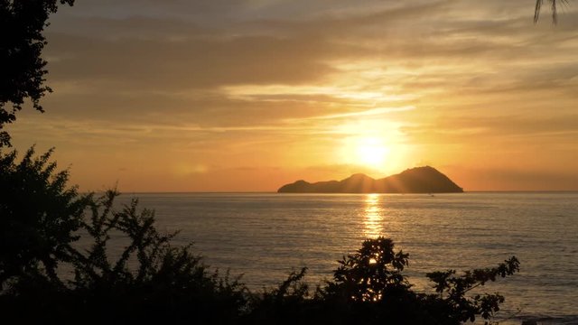 Sundown over the island of Mararison or Malalison in the Philippines