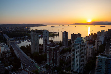 Fototapeta premium Beautiful aerial cityscape view during a vibrant sunny sunset. Taken in Downtown Vancouver, British Columbia, Canada.