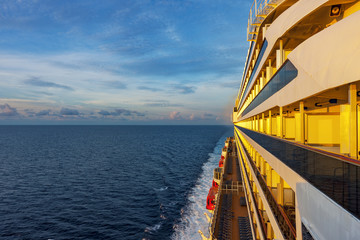 Board of the passenger liner lit by the sunrise