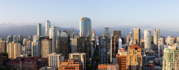 Fototapeta premium Downtown Vancouver, British Columbia, Canada - May 16, 2018: Aerial view of the modern city skyline during a sunny sunset.