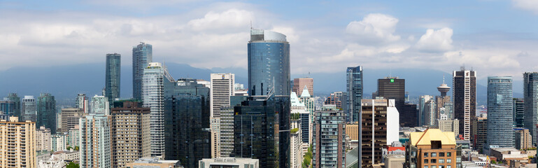 Fototapeta na wymiar Downtown Vancouver, British Columbia, Canada - May 16, 2018: Aerial view of the modern city skyline during a sunny day.