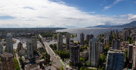 Aerial panoramic view of a beautiful modern cityscape during a cloudy day.Taken in Downtown Vancouver, British Columbia, Canada. High Quality and Resolution