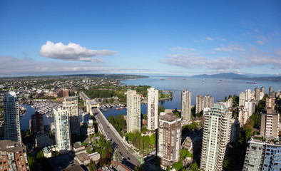 Striking Aerial View of the Modern City during a vibrant sunny day. Taken in Downtown Vancouver, British Columbia, Canada.
