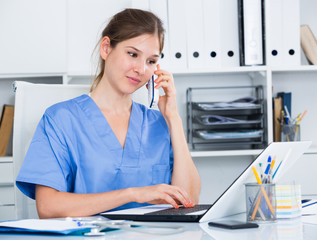 Female doctor advising patient on phone