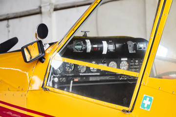 Closeup view of Zlin Z-37 Cmelak agricultural airplane cockpit from outside made in Czechoslovakia.