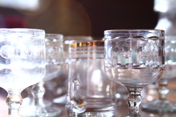 Old empty dusty glasses on the table. Close-up. Background.