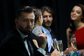 Handsome man playing in casino