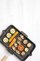 Grilled vegetables in a grilling pan, top view. From above, overhead. Copy space.