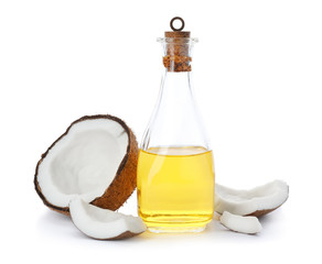 Ripe coconut and bottle with oil on white background. Healthy cooking © New Africa
