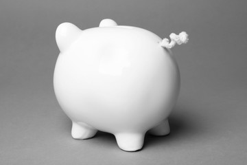 Cute white piggy bank on gray background