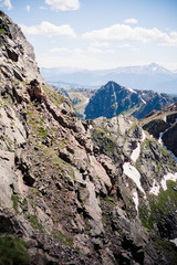 Close up view of jagged mountain peaks from a peak of the Gore Range in Colorado