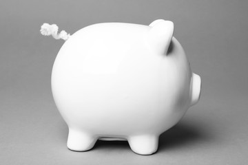 Cute white piggy bank on gray background