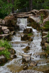 Fototapeta na wymiar Small Waterfall at Japanese Garden